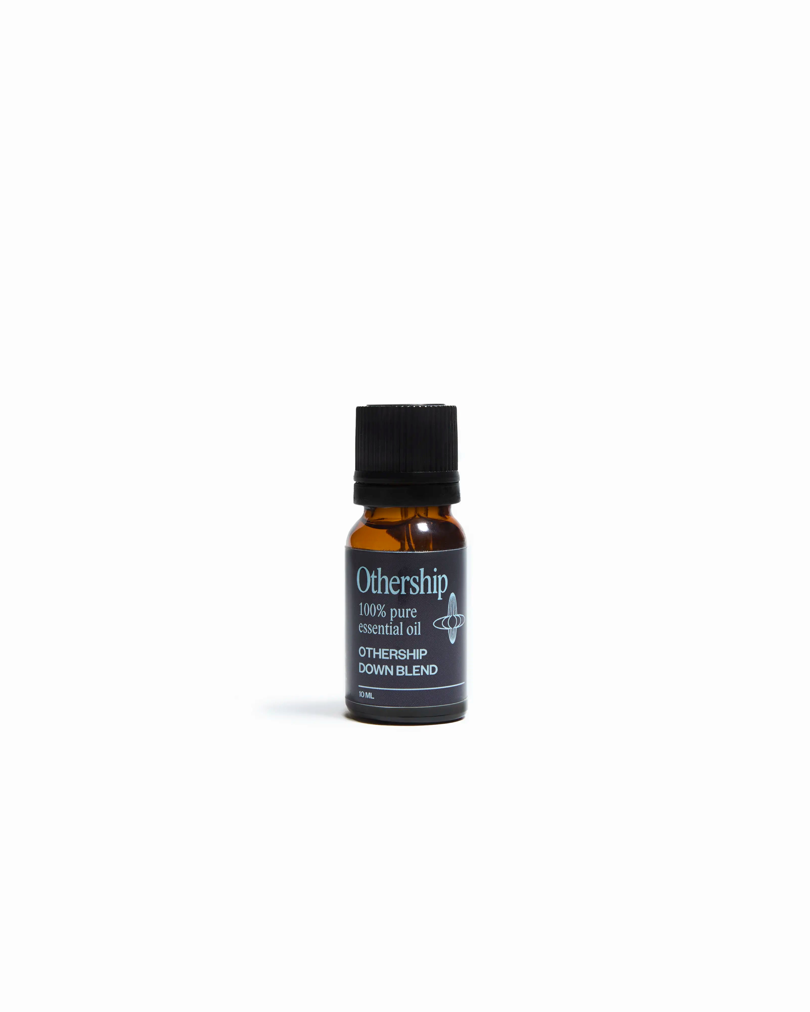 Othership Down Blend Essential Oil for diffusers, grounding woody blend designed for deep relaxation, calm, and mindfulness.