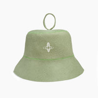 Back view of the light green felt sauna hat showing the embroidered Othership symbol and top loop.